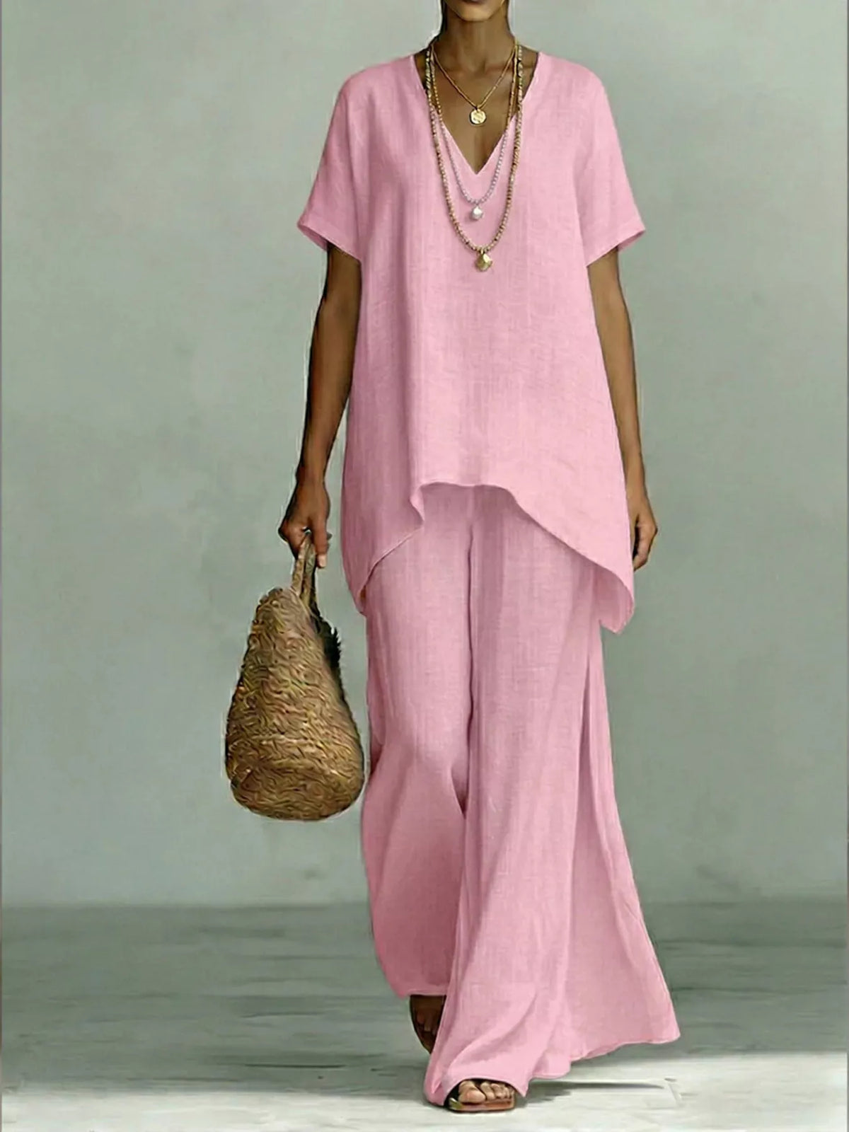 Plus size V-neck top and wide-leg pants set from Plush Fashion Hub, showcasing a comfortable, stylish two-piece outfit.
