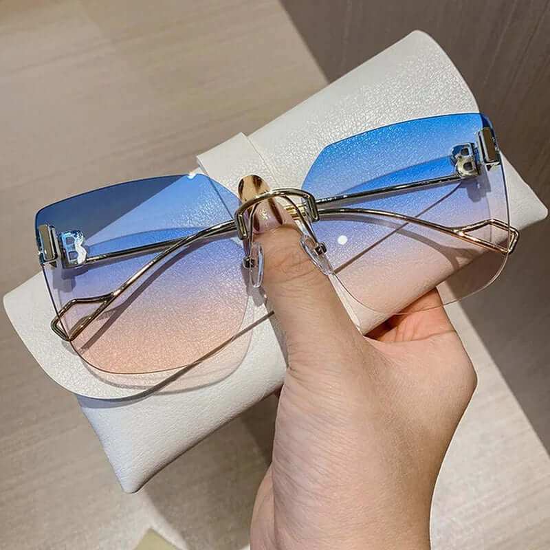 Vintage Brand Designer Sunglasses Fashion Oversized Rimless SunglassesElevate your style with our Vintage Brand Designer Sunglasses. Made with high-quality materials, these oversized rimless sunglasses offer 99% UV protection and 1.3 mSunglassesPlush Fashions ShopPlush Fashion Shop