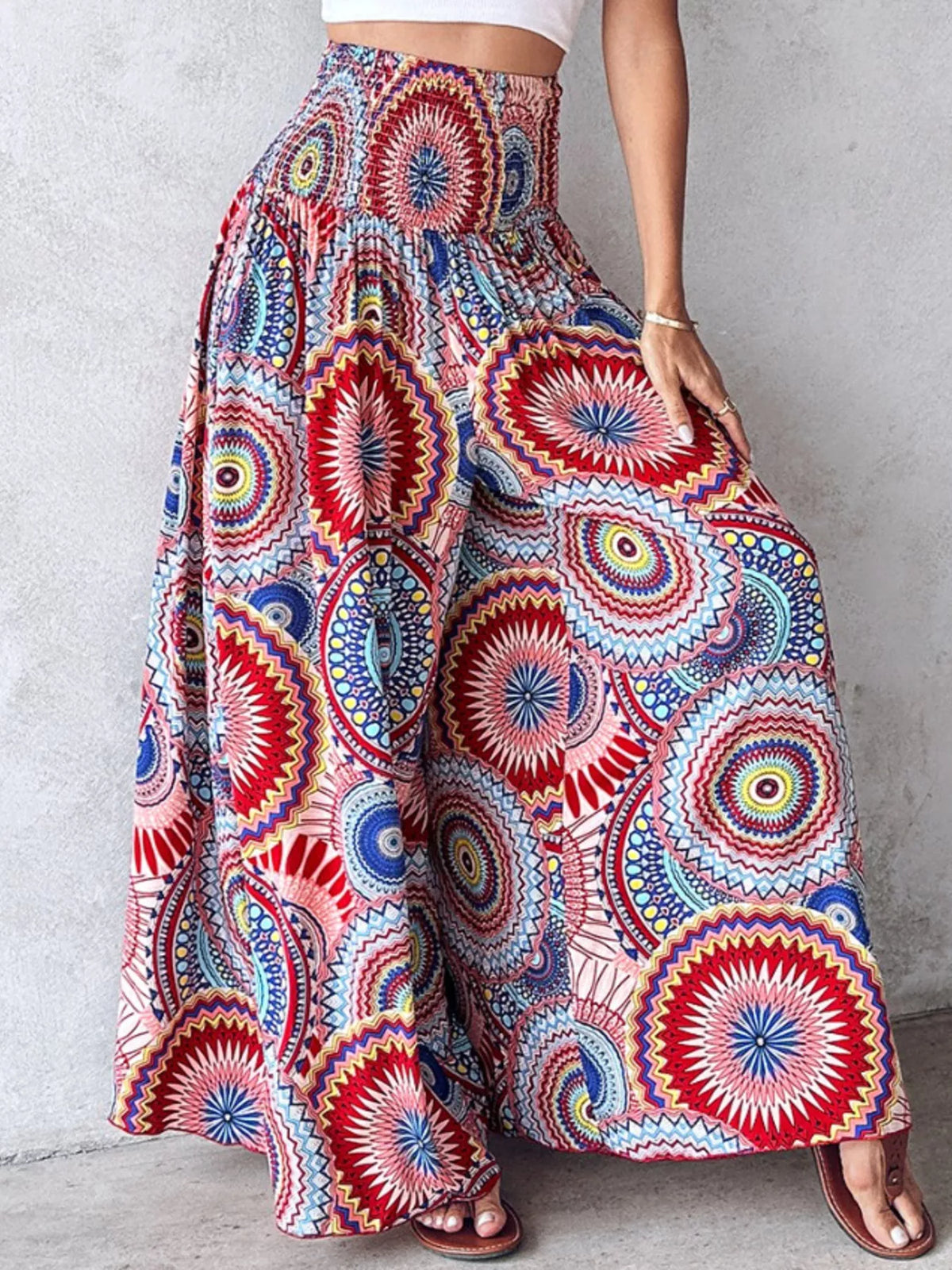 Printed wide-leg pants from Plush Fashion Hub featuring a vibrant floral pattern and relaxed fit, displayed on a hanger.