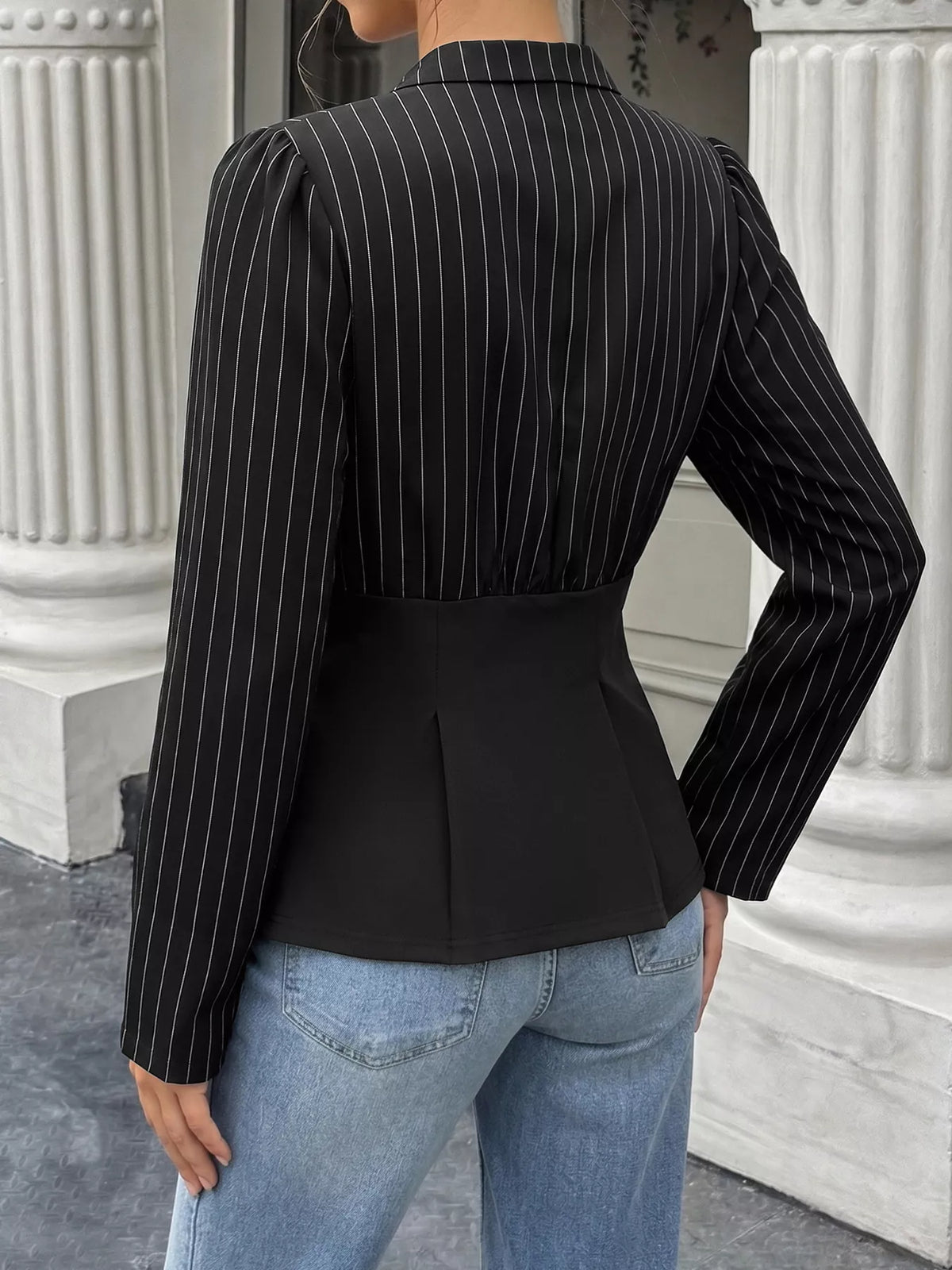 Striped long sleeve peplum blouse for women by Trendsi, featuring a fitted design with bold horizontal stripes and a stylish peplum hem.