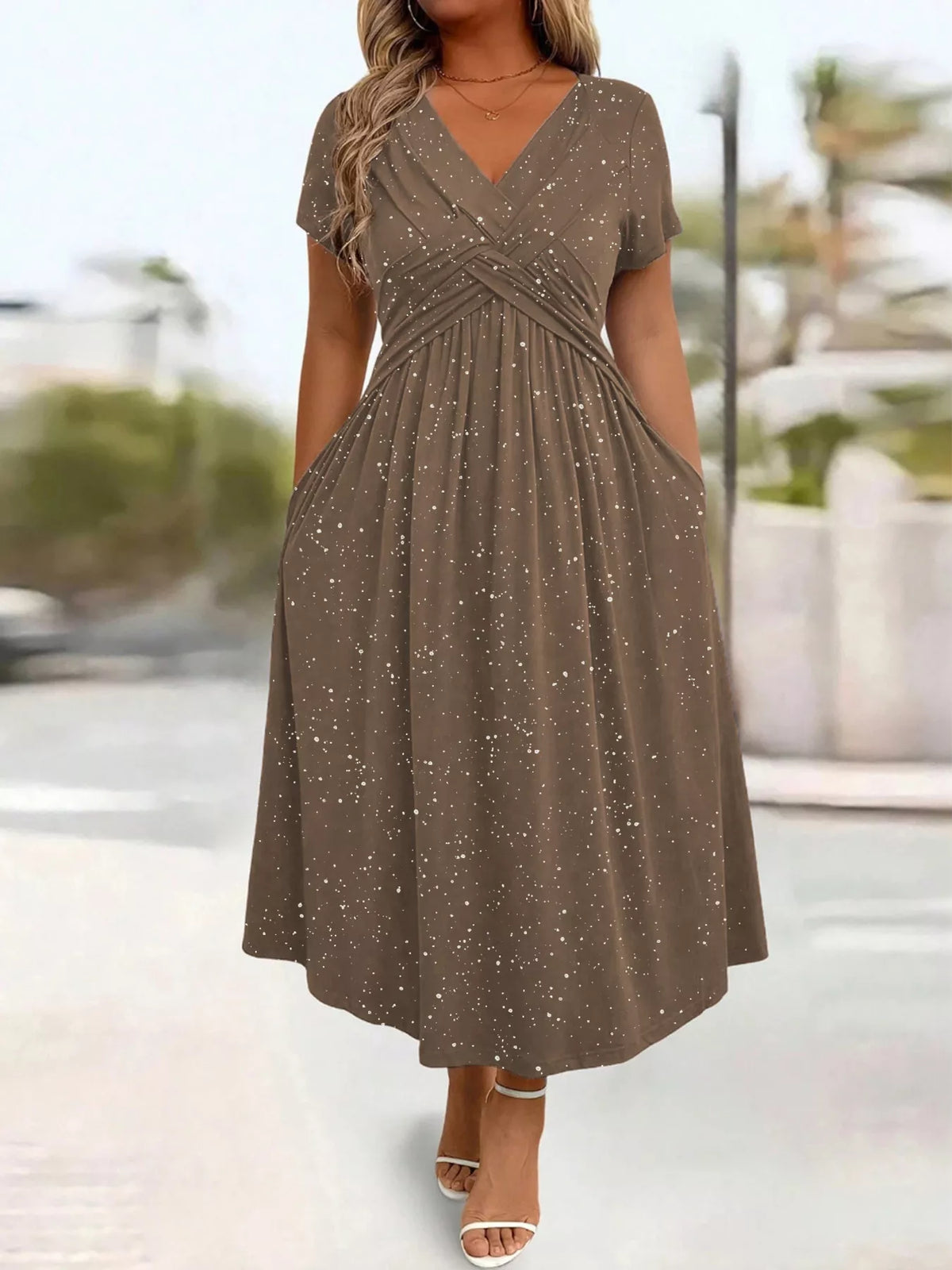 Plus size glitter flutter sleeve midi dress by Trendsi, showcasing a shimmering fabric and flowing silhouette perfect for special occasions.