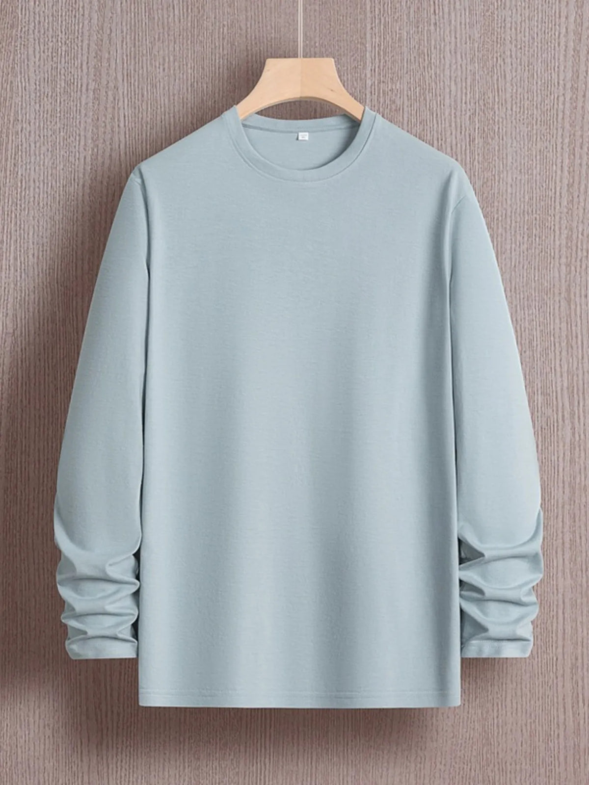 Men's plus size round neck long sleeve T-shirt by Trendsi, in a comfortable fit, shown in a neutral color, casual style.