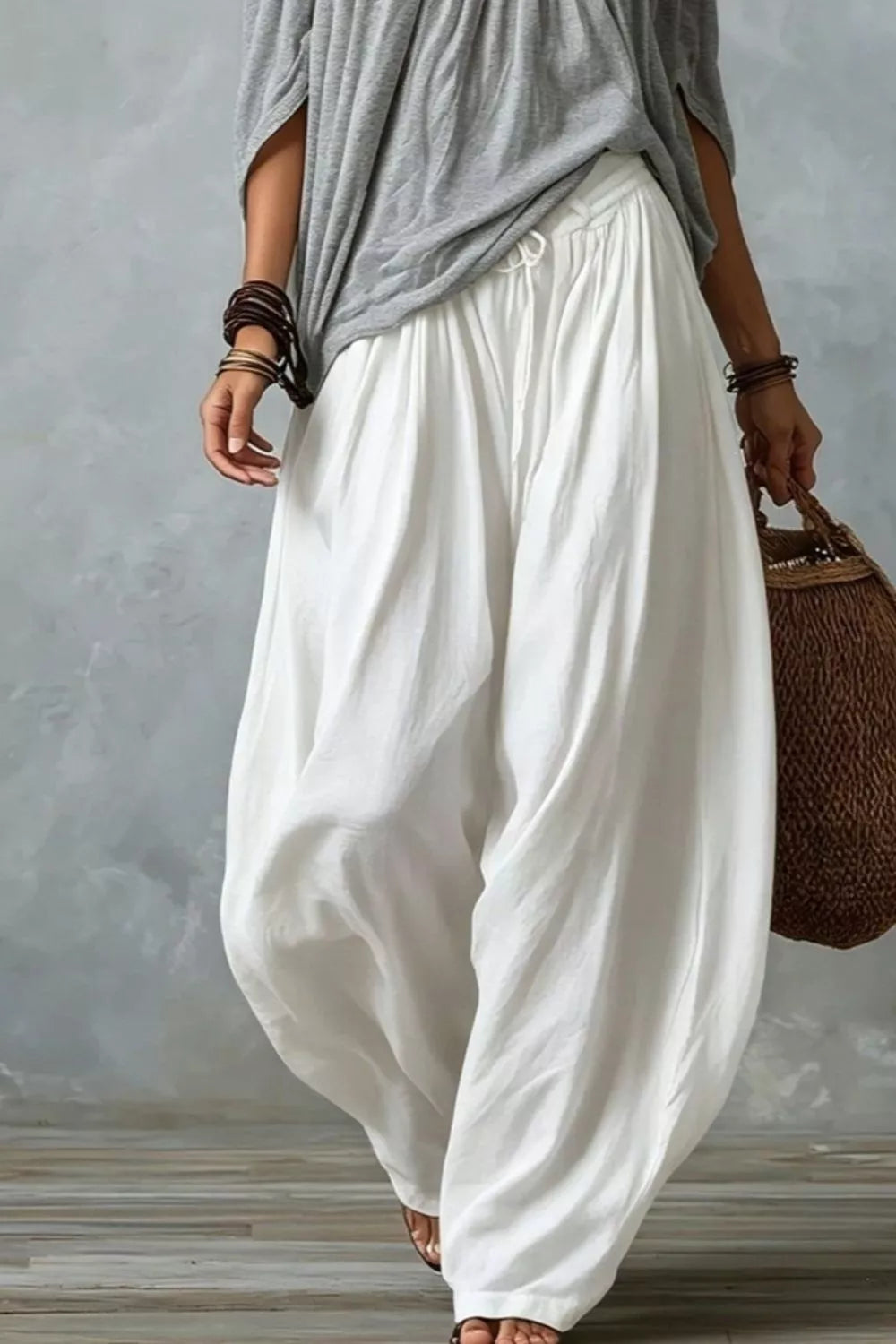 Plus size off-shoulder top and wide-leg pants matching set by Trendsi, featuring a stylish, coordinated fashion look.