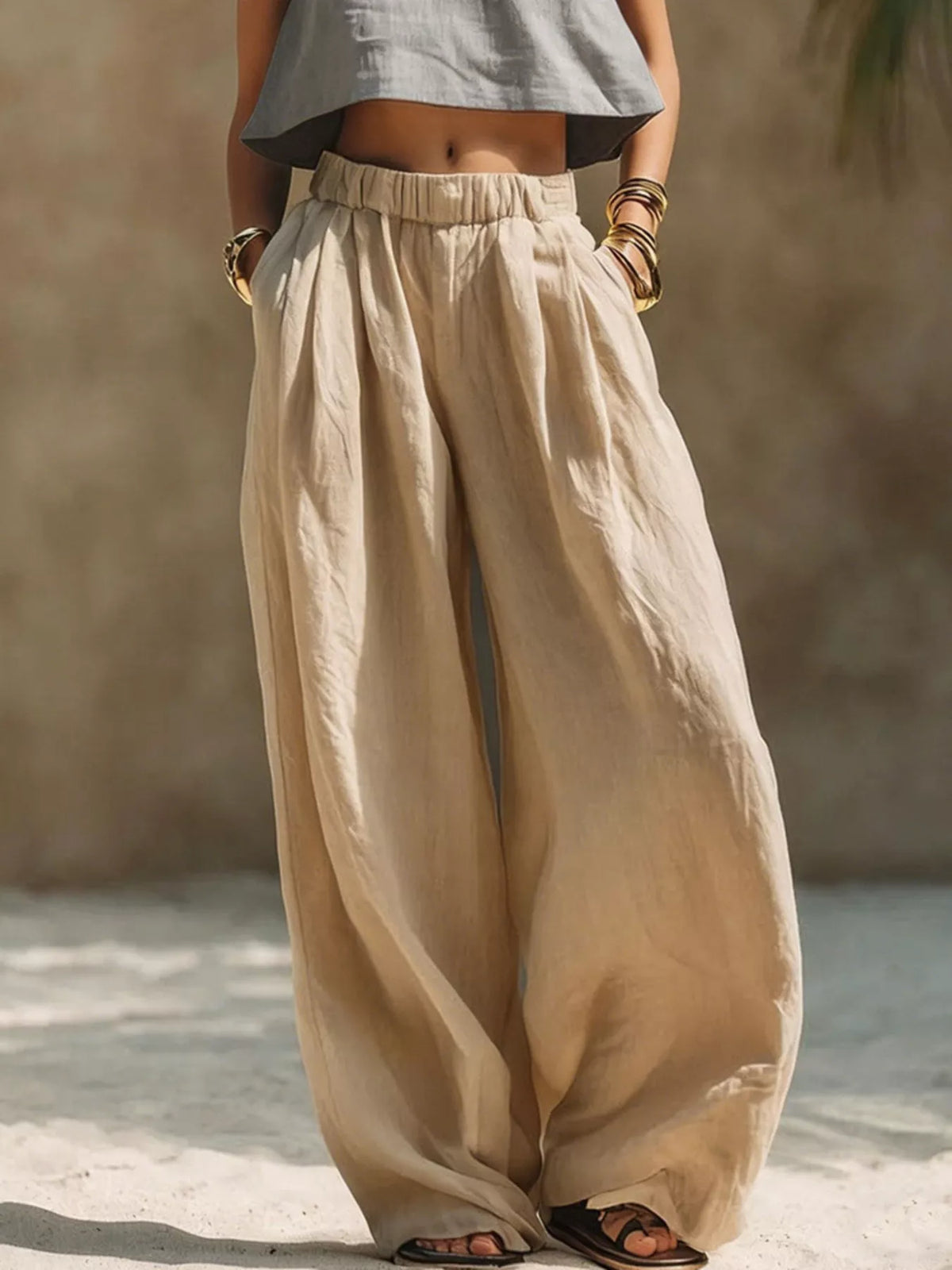 Plus size wide leg pants with full elastic waistband by Trendsi, shown in a relaxed fit style.