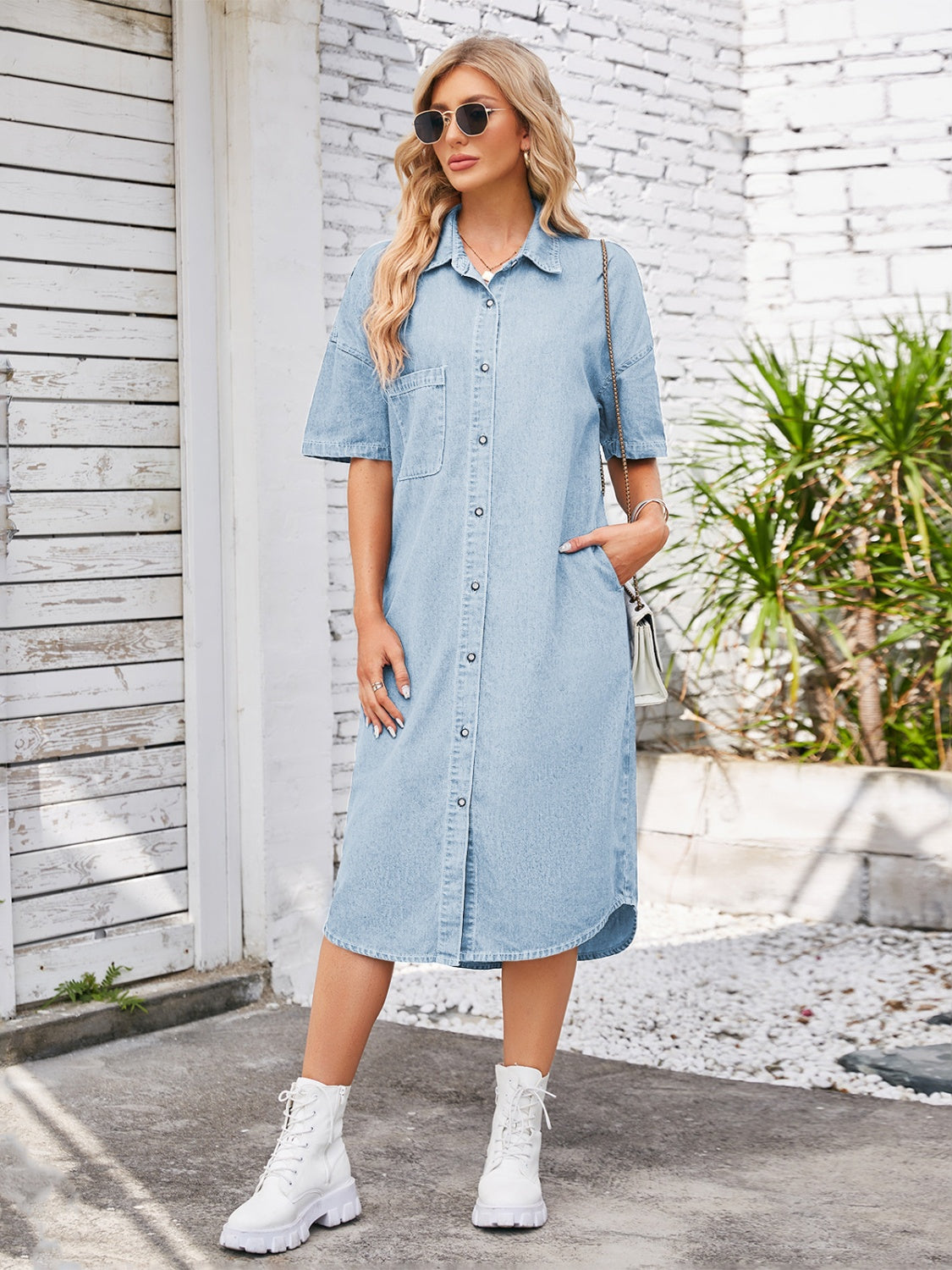 Denim button-up dropped shoulder dress by Plush Fashion Hub, featuring a casual fit with long sleeves and front button details.