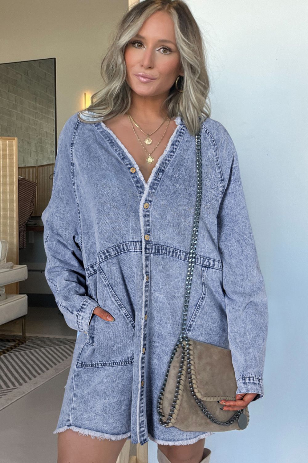 Raw hem button-down long sleeve denim dress by Plush Fashion Hub, featuring a casual fit and classic blue denim fabric.