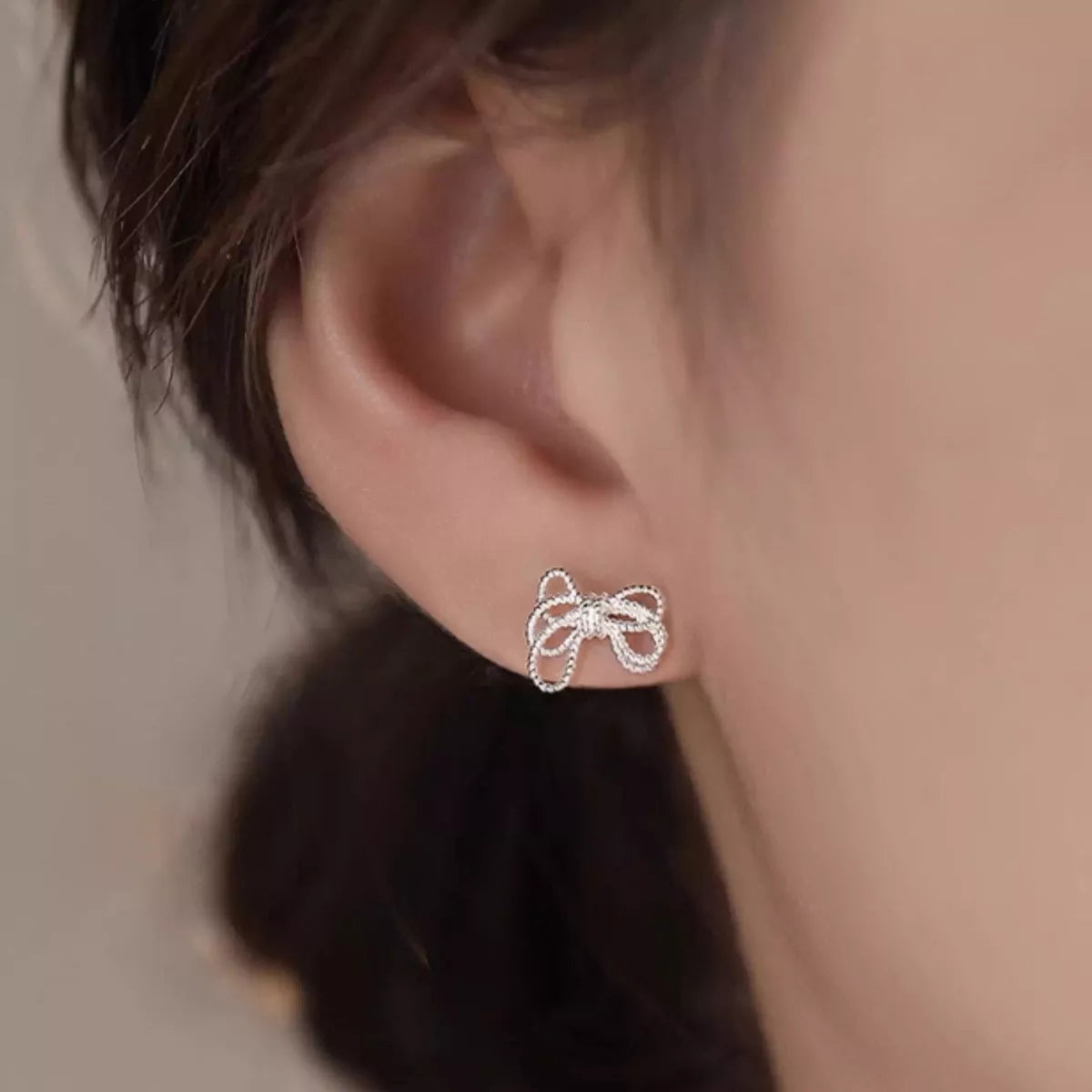 925 Sterling Silver Bow Knot Stud Earrings with polished finish, designed by Plush Fashion Hub for a elegant, everyday look.