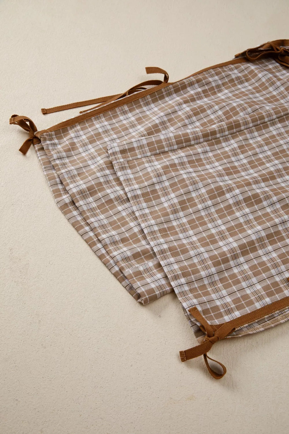 Casual plaid print pants with tie detail from Trendsi, featuring a relaxed fit and stylish design.