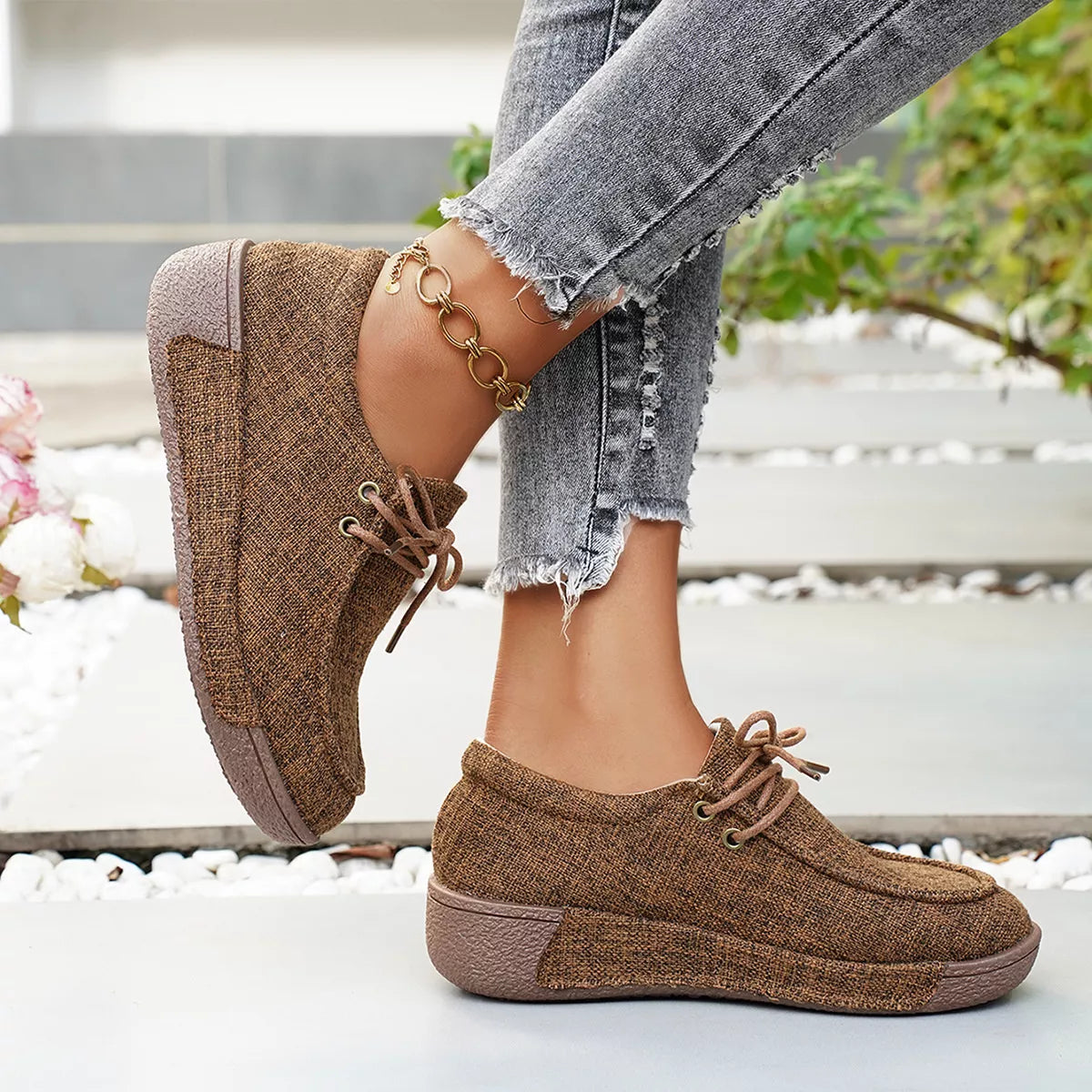 Round toe lace-up sneakers by Trendsi, stylish footwear with a classic design, featuring white laces and a clean, modern look.