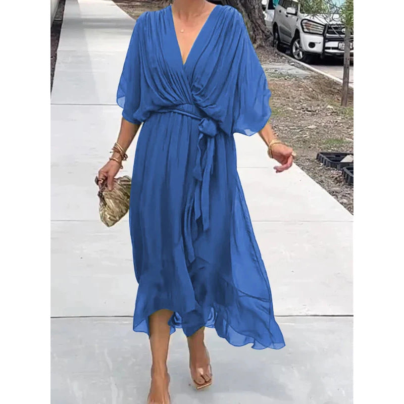 Batwing sleeve V-neck midi dress with tied irregular hem from Plush Fashion Hub, featuring a flowy, fairy-style silhouette.