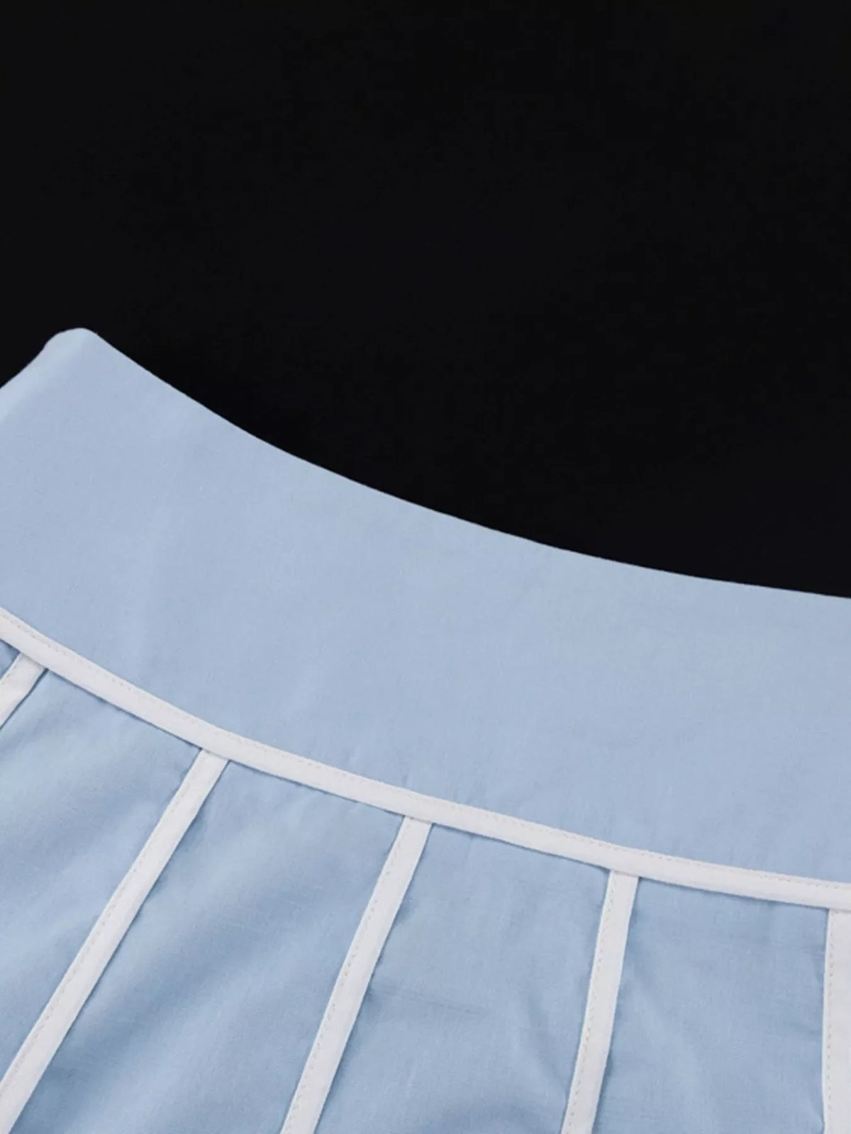 Contrast trim halter neck top and matching skirt set by Plush Fashion Hub, featuring stylish design and coordinating fabric.