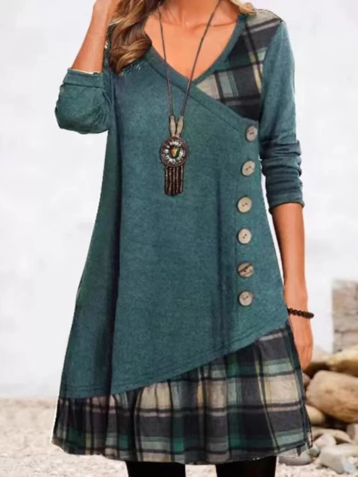 Plus size asymmetrical plaid patchwork long sleeve dress by Trendsi, featuring a stylish full-size design with a modern, asymmetrical hem.