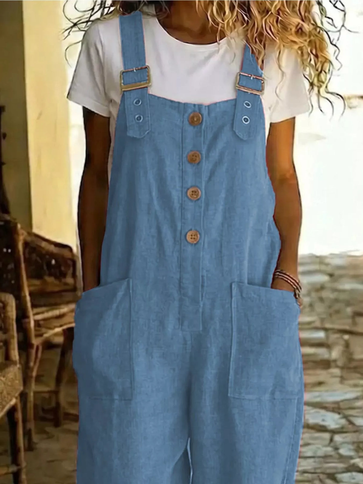 Casual button-front wide-leg overalls from Plush Fashion Hub, featuring a relaxed fit and adjustable straps on a model.