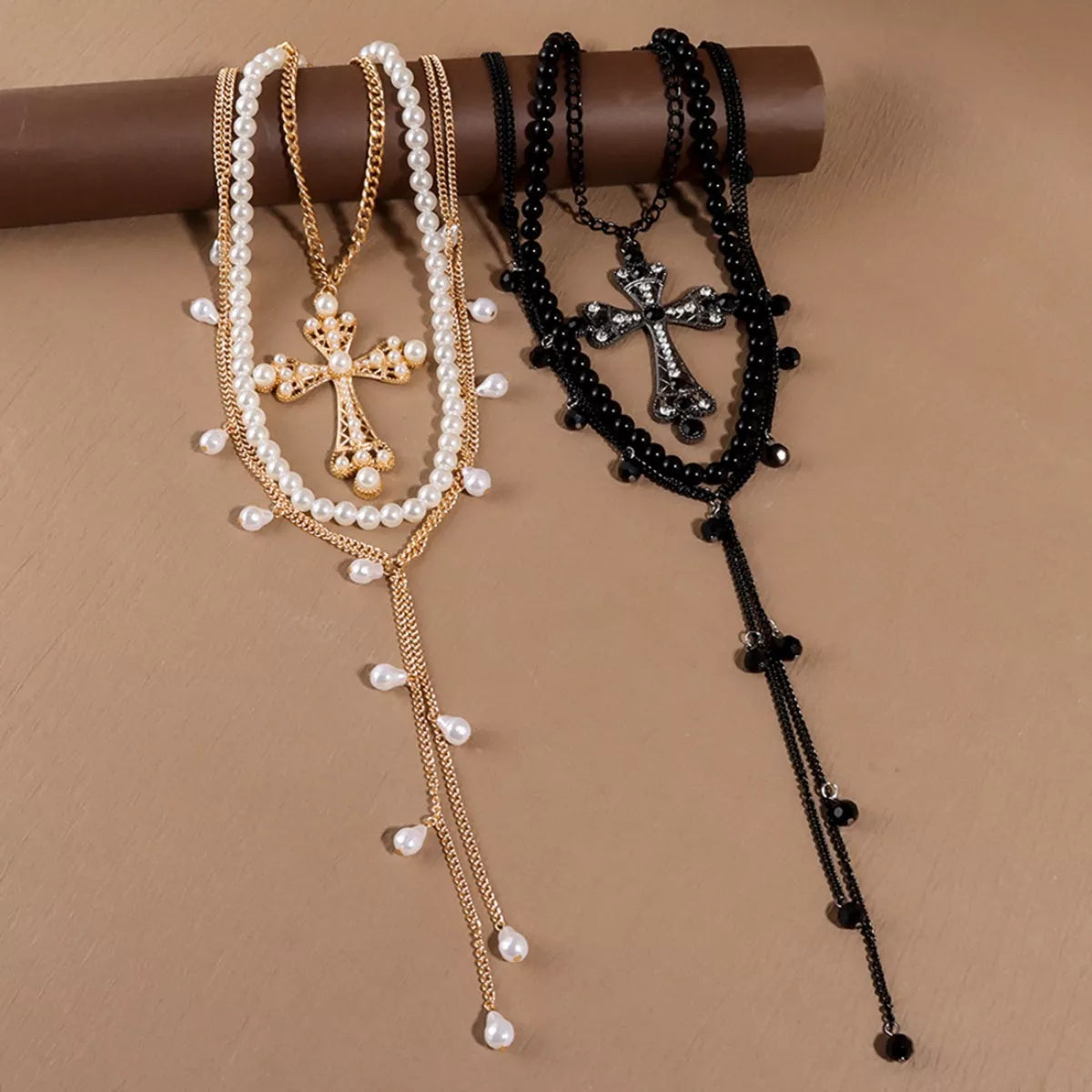 Three-piece set of pearl cross pendant necklaces from Plush Fashion Hub, featuring elegant cross and pearl designs.