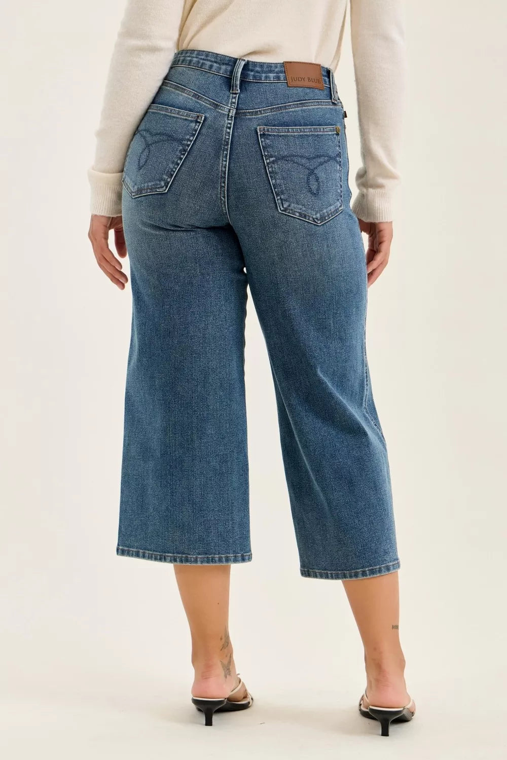 Plush Fashion Hub Judy Blue high waist Dottie wide crop jeans in medium quarry fade with distressed details and wide leg style.