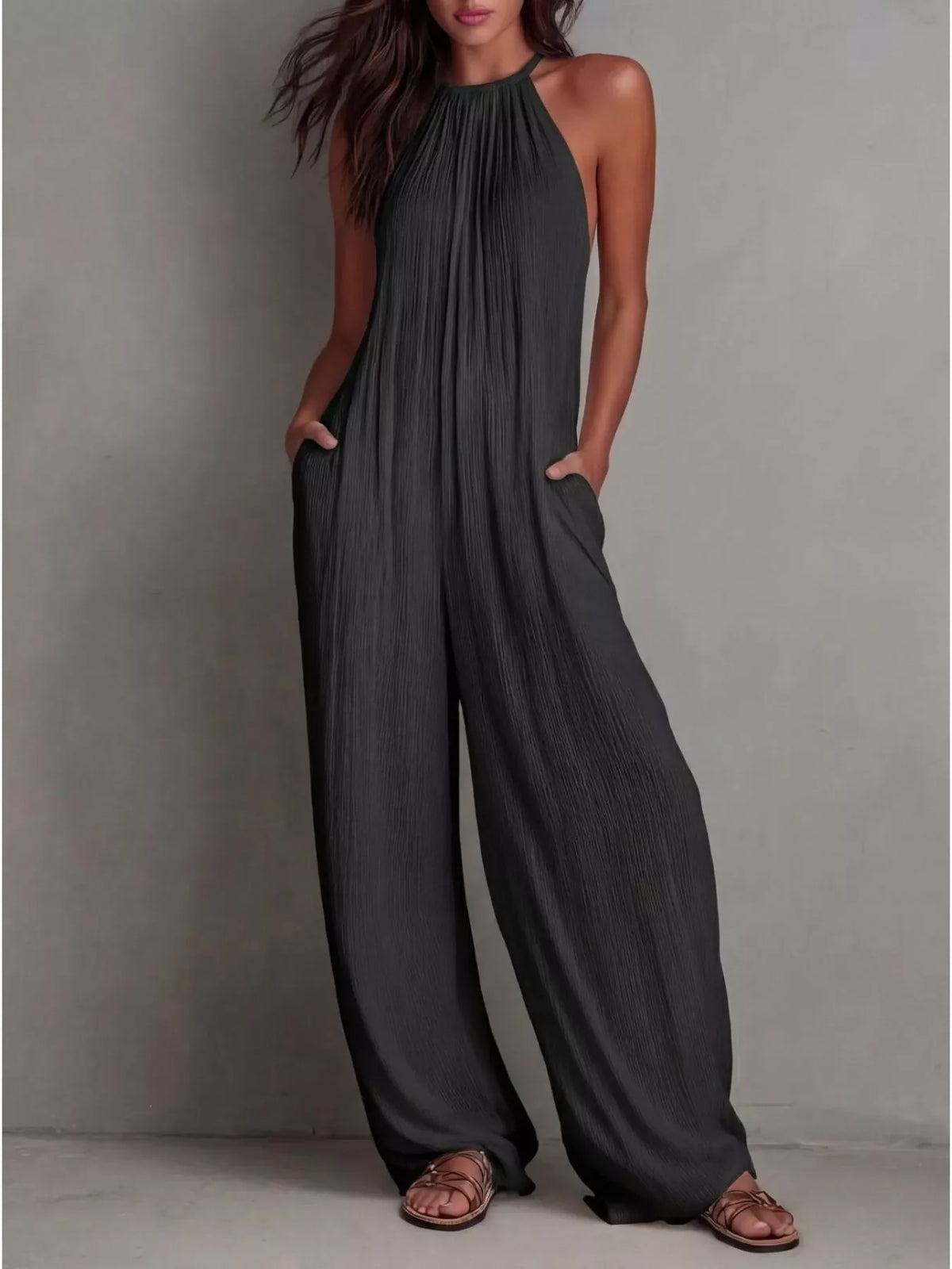 Plush Fashion Hub sleeveless wide-leg jumpsuit with a relaxed fit and stylish design, shown on a model against a white background.