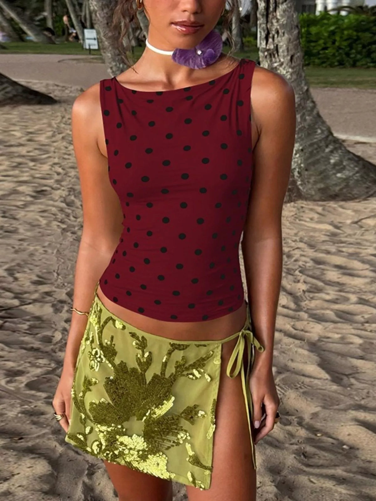 Polka dot tank top from Plush Fashion Hub featuring a sleeveless design with a stylish polka dot pattern.