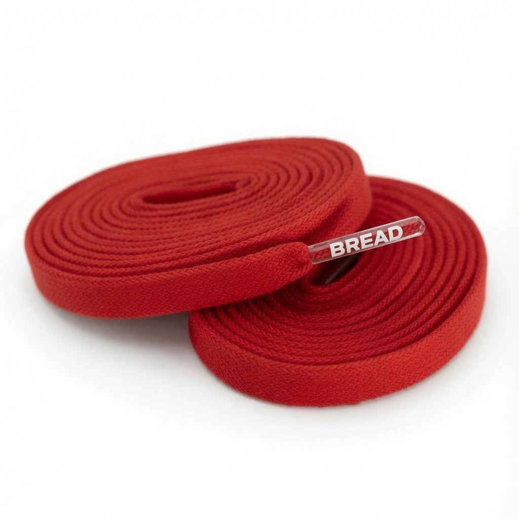 Red elastic shoelace by Bread, flexible stretch laces for casual shoes, shown in the image.