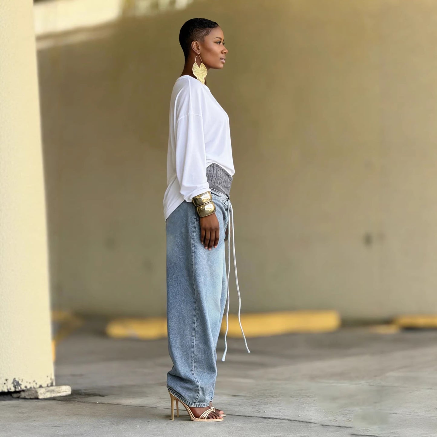 Distressed washed wide-leg jeans by eprolo featuring a relaxed fit and frayed details, displayed on a neutral background.