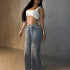 High-waisted, light wash wide-leg denim jeans embellished with scattered rhinestones and a matching crystal belt.