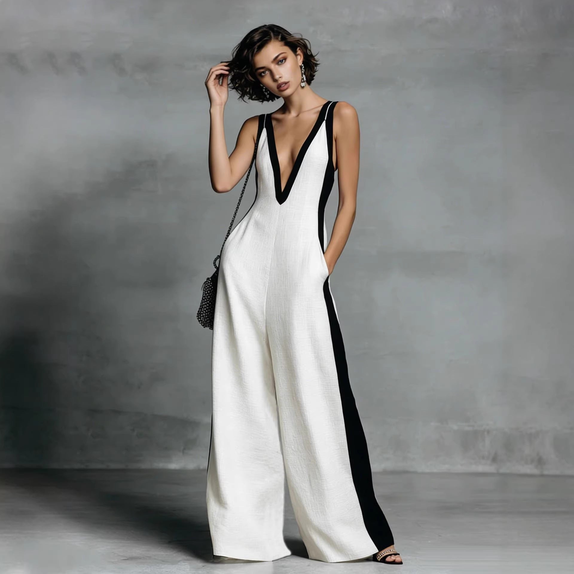 Women's color-block sleeveless V-neck jumpsuit with wide-leg pants, casualwear by Plush Fashion Hub, featuring a stylish French-inspired design.
