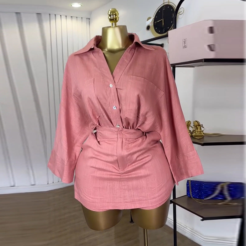 Plush Fashion Hub modern two-piece batwing shirt and high-waisted skirt set, stylish tops with flowing sleeves and fitted skirt.