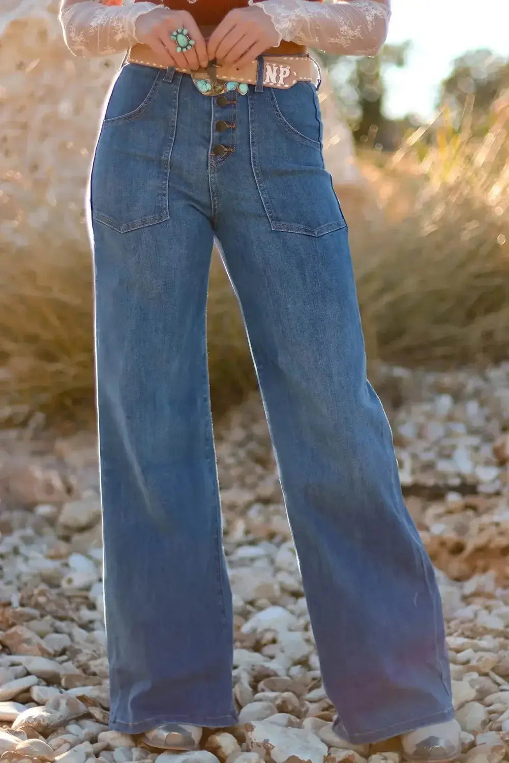 Light blue Aleah waist-wide leg jeans by Threaded Pear, shown on a model with a relaxed fit and high-rise waist.