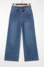 Light blue Aleah waist-wide leg jeans by Threaded Pear, showcasing a relaxed fit and classic denim style.