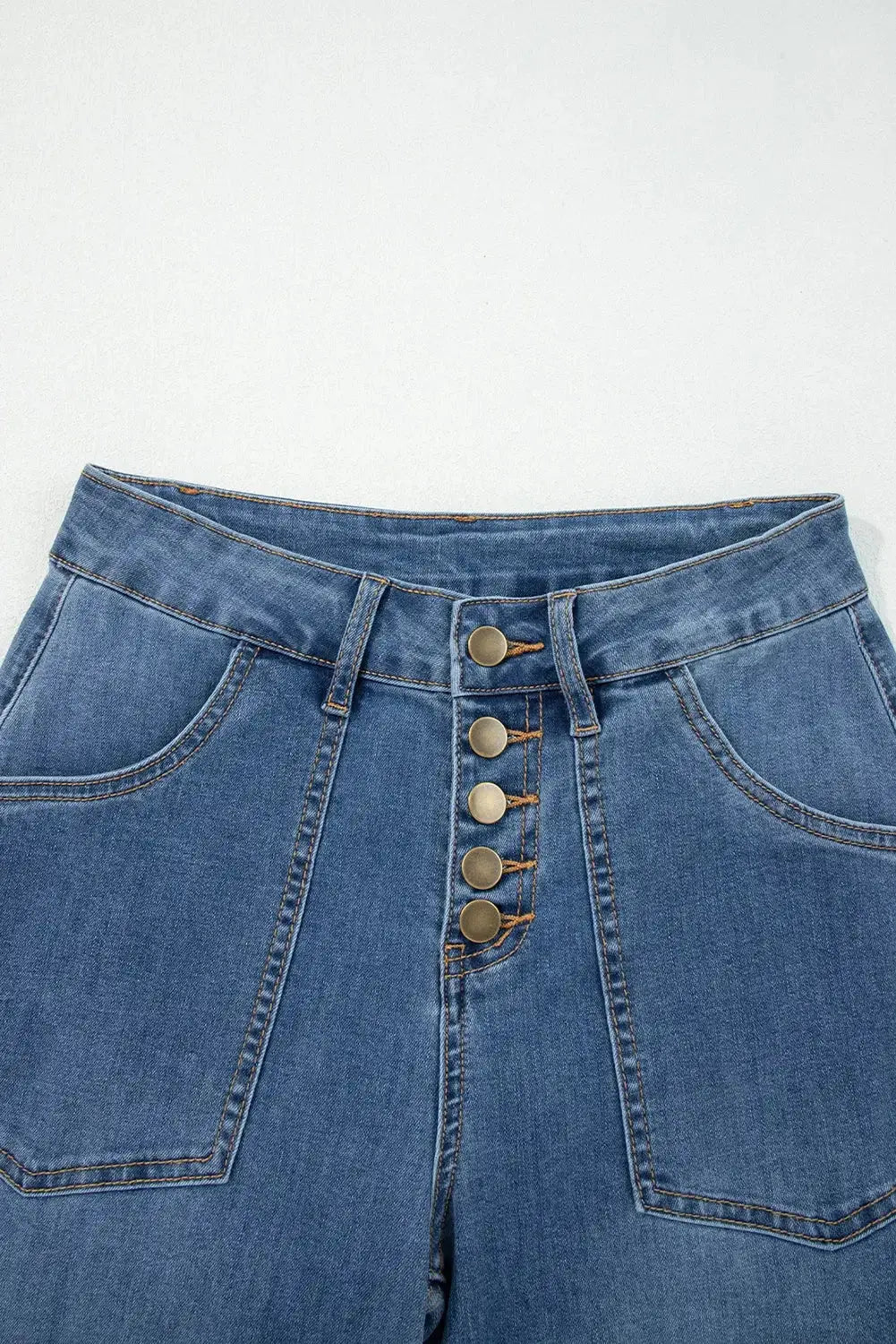 Light blue Aleah waist-wide leg jeans by Threaded Pear displayed on a model, showcasing relaxed fit and trendy style.