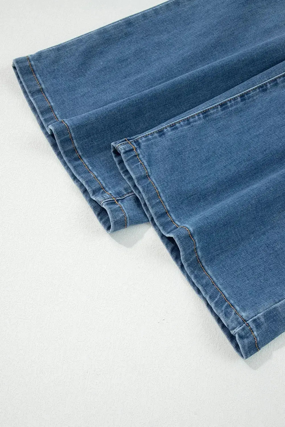 Light blue Aleah waist-wide leg jeans by Threaded Pear, featuring a high waist and relaxed fit, displayed on a model.