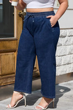 Analeia wide-leg casual plus jeans by Threaded Pear, featuring relaxed fit and denim fabric, displayed on a hanger.