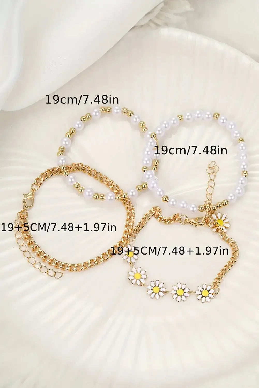 April beaded chain bracelet set by Threaded Pear featuring multiple delicate beaded jewelry pieces on a neutral background.