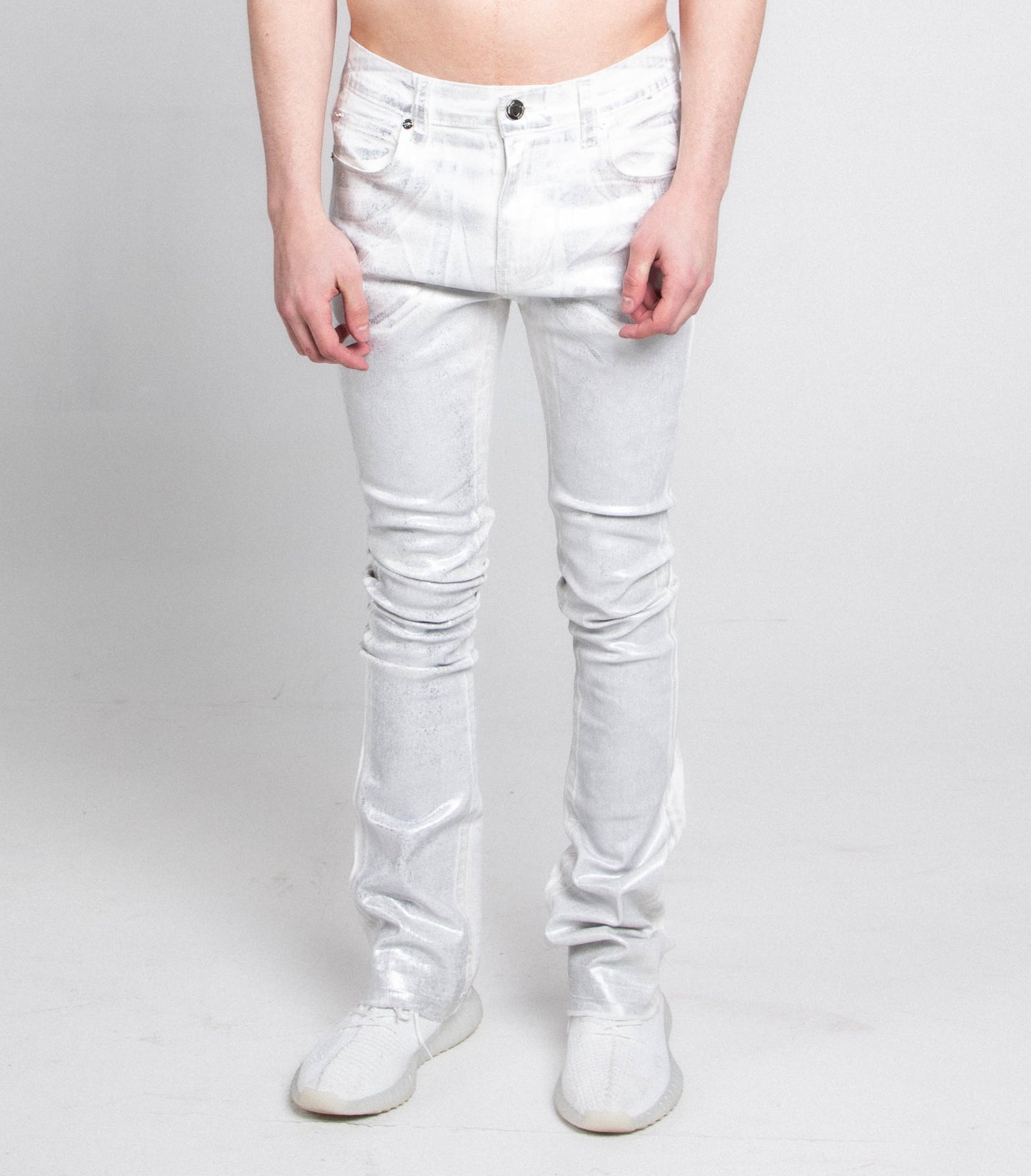 Stacked silhouette jeans pants from Plush Fashion Hub with a fitted waistband and distressed denim design.