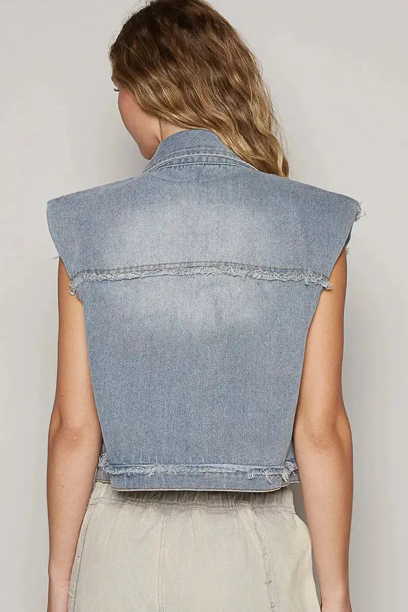 Distressed asymmetrical sleeveless denim vest with raw hem from Plush Fashion Hub, featuring a trendy, edgy jean jacket style.