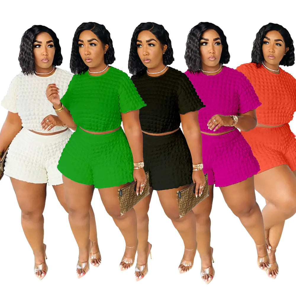 Plus size women's summer casual two-piece set featuring trendy shorts and top, stylish and comfortable for warm weather.