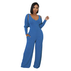 Modern cape-sleeve tailored jumpsuit by eprolo, featuring sleek design and structured fit, shown in a stylish tops image.