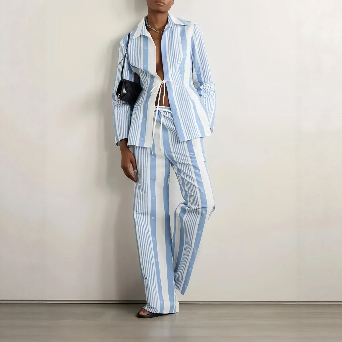 Blue and white striped wide-leg lounge bottoms from eprolo, featuring a relaxed fit and comfortable fabric for casual wear.