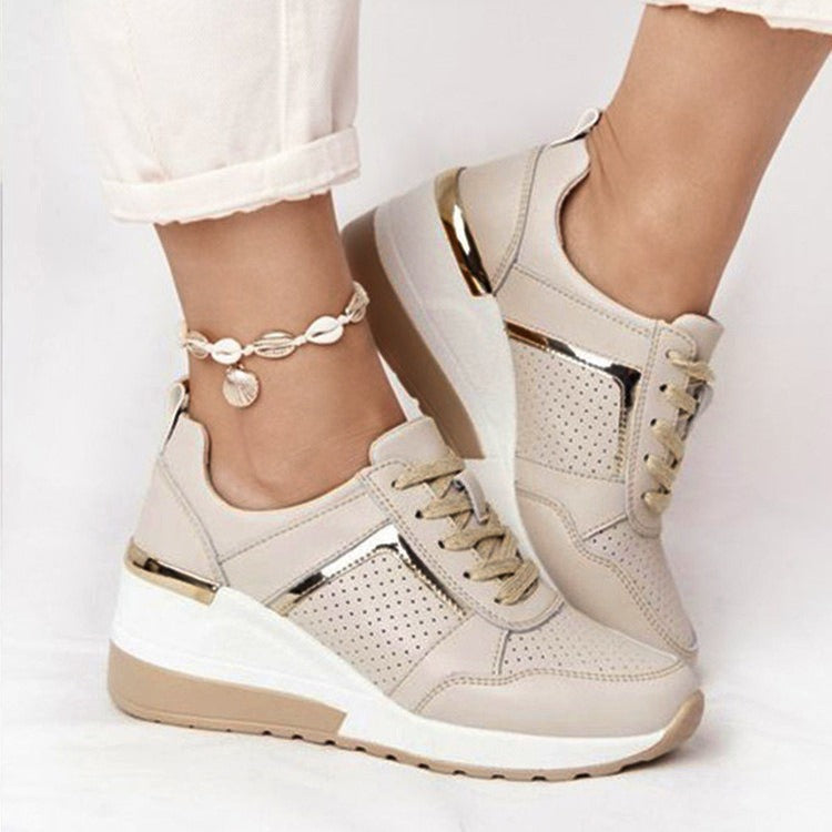 Beige mesh platform sneakers with gold metallic accents, white soles, and matching beige laces.