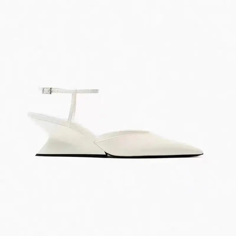 Elegant white pointed-toe wedge sandals with a thin buckled ankle strap and a translucent sculptural wedge heel.