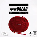 Red elastic shoelace by Bread, showing close-up of flexible, vibrant red material with metal aglets for easy lacing.