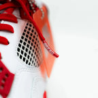 Red elastic shoelace by Bread, showcasing bright, flexible laces with secure fit and vibrant color for casual footwear.