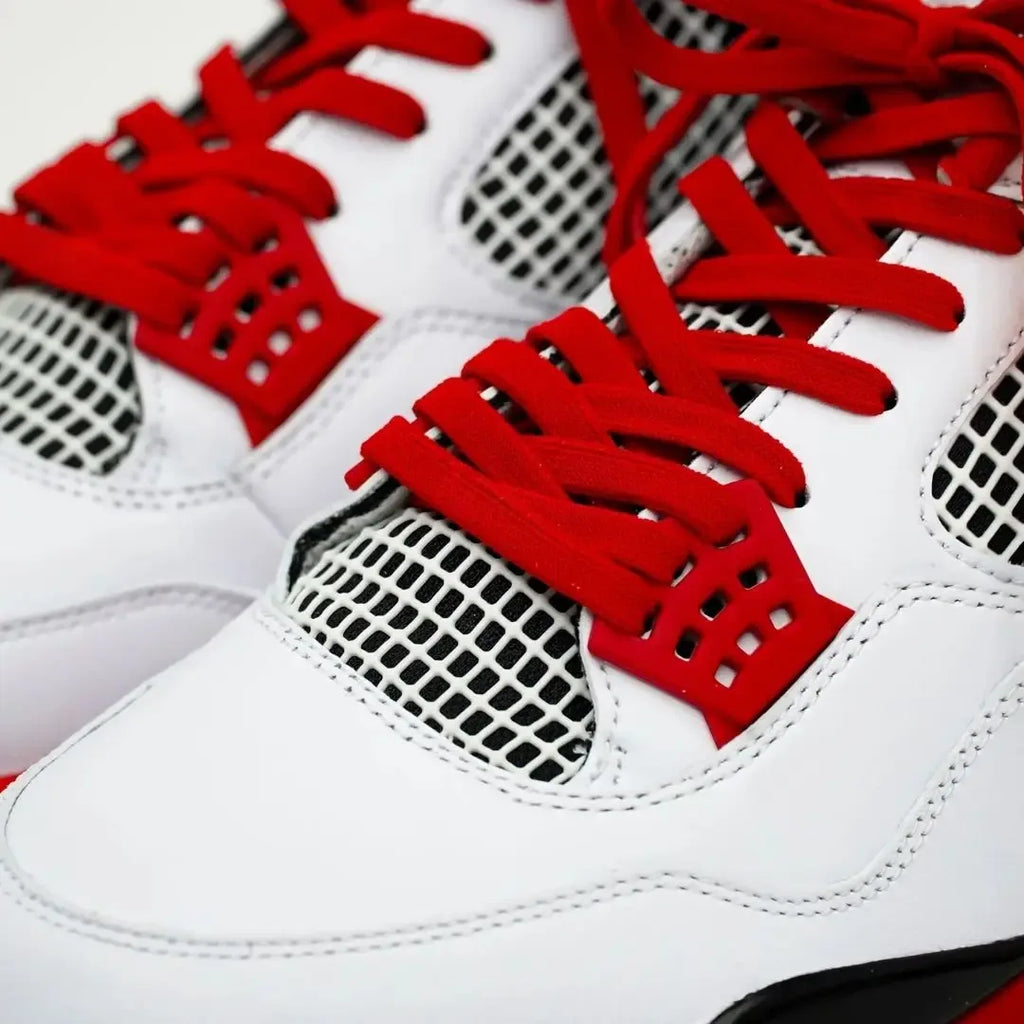 Red elastic shoelace by Bread, showing its flexible, stretchy material and vibrant color ideal for casual footwear.