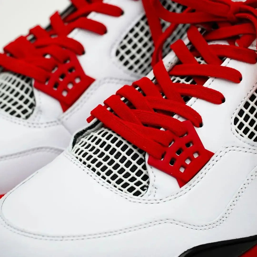 Red elastic shoelace by Bread, showing its flexible, stretchy material and vibrant color ideal for casual footwear.