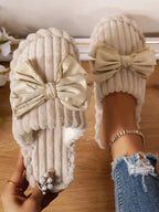 Women's bow-embellished cozy indoor slippers with cushioned EVA sole by Plush Fashion Hub, featuring plush material and stylish design.