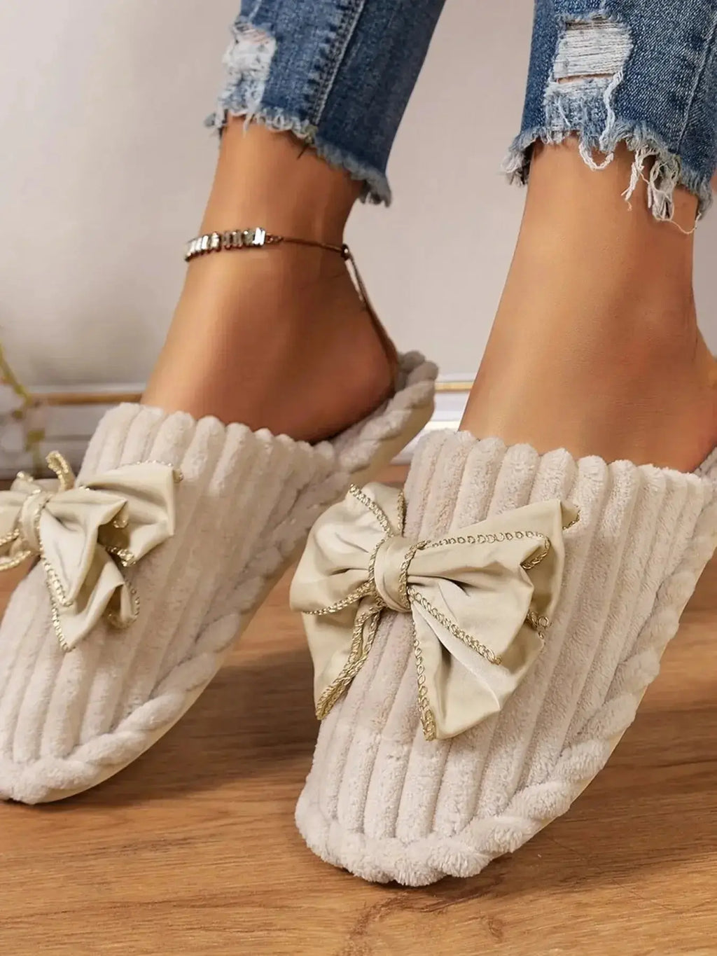 Women's bow-embellished cozy indoor slippers with cushioned EVA sole by Plush Fashion Hub, featuring plush material and stylish design.