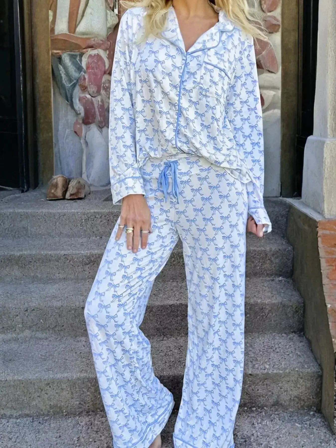 Women’s bow print long sleeve pajama set by Plush Fashion Hub featuring a button-down top and matching pants for soft loungewear.