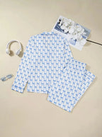 Women's bow print long sleeve pajama set from Plush Fashion Hub featuring a button-down shirt and matching pants for soft loungewear.