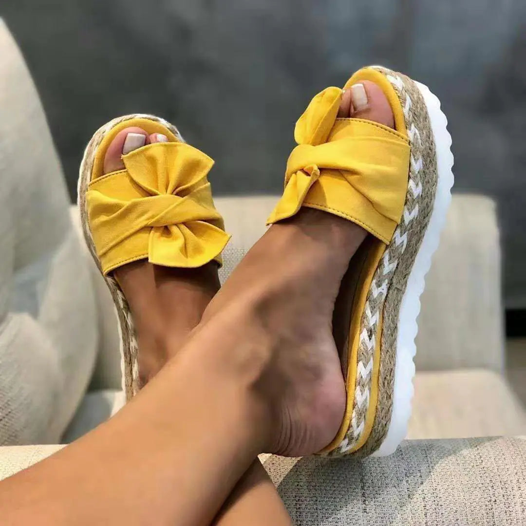 Women’s bow sandals with platform wedge heel by Trendy Attic Store01, featuring stylish bow accents and comfortable slip-on design.