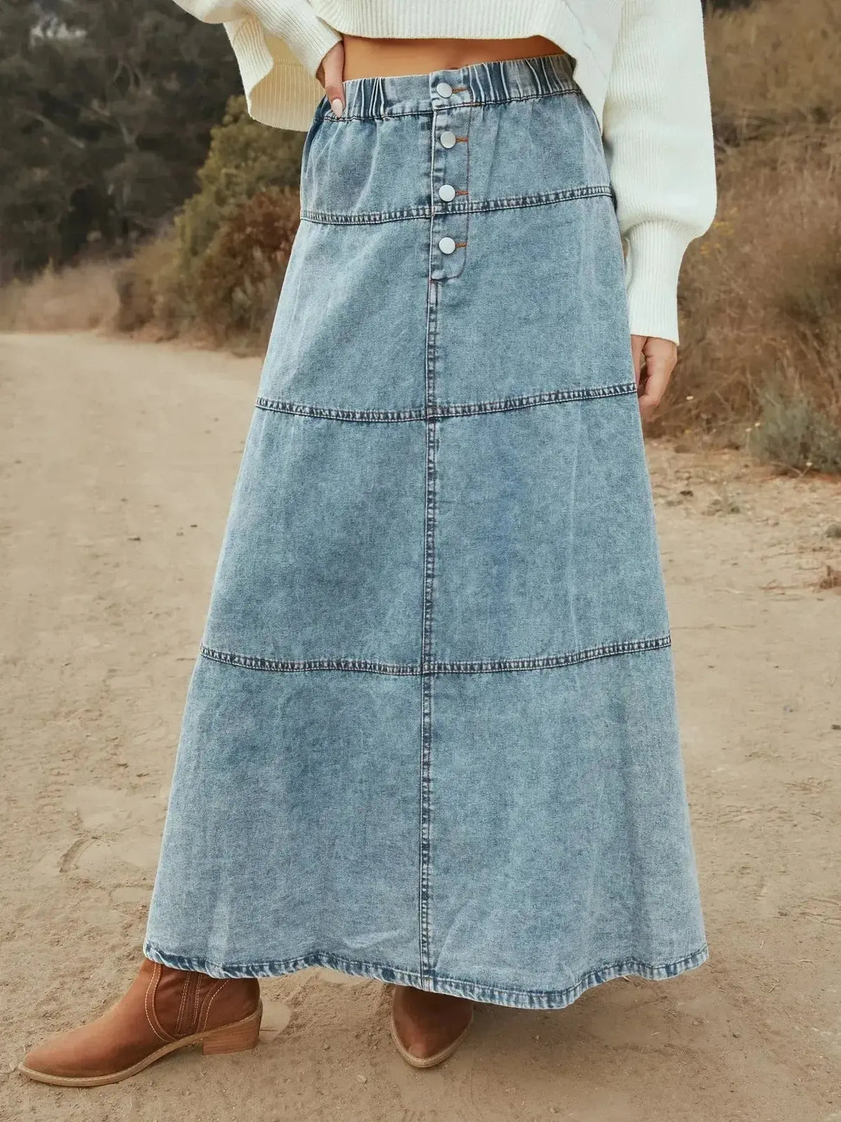 Flowy button-front tiered maxi denim skirt by Plush Fashion Hub, featuring a casual long jean style with a relaxed fit.