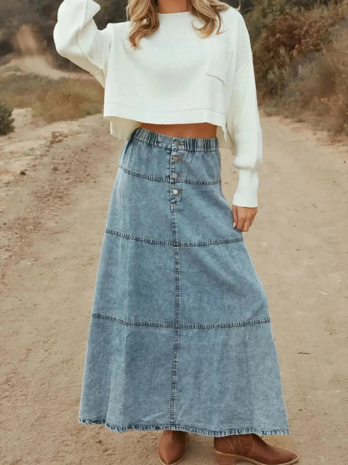 Flowy button-front tiered maxi denim skirt from Plush Fashion Hub, featuring a casual long jean style with a trendy design.